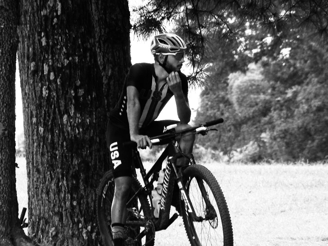 Douglas in USA kit beside his bike