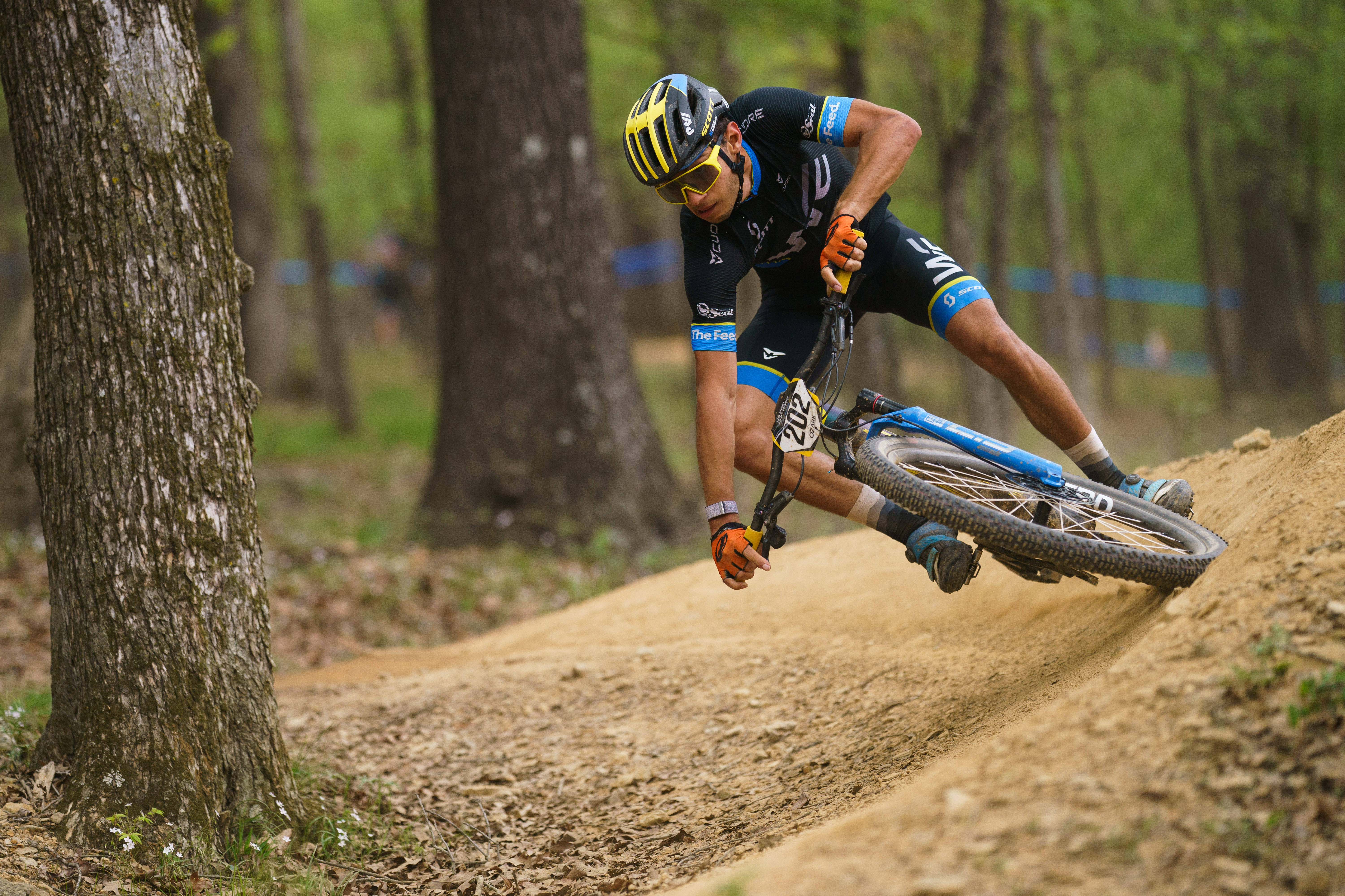 Douglas Gambarota cornering at speed on a wooded cross-country course